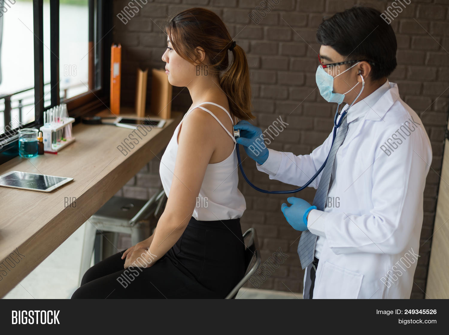 Patient,adult,back,beat,care,clinic,coat,consultation,doctor,exam,examination,female,flashlight,general,glove,hand,health,heart,hospital,human,mask,medical,medicine,ophthalmology,person,personnel,physical,practitioner,professional,pupil,pupillary,rate,reflex,scientist,stethoscope,surgery,symptomatology,test,white,woman