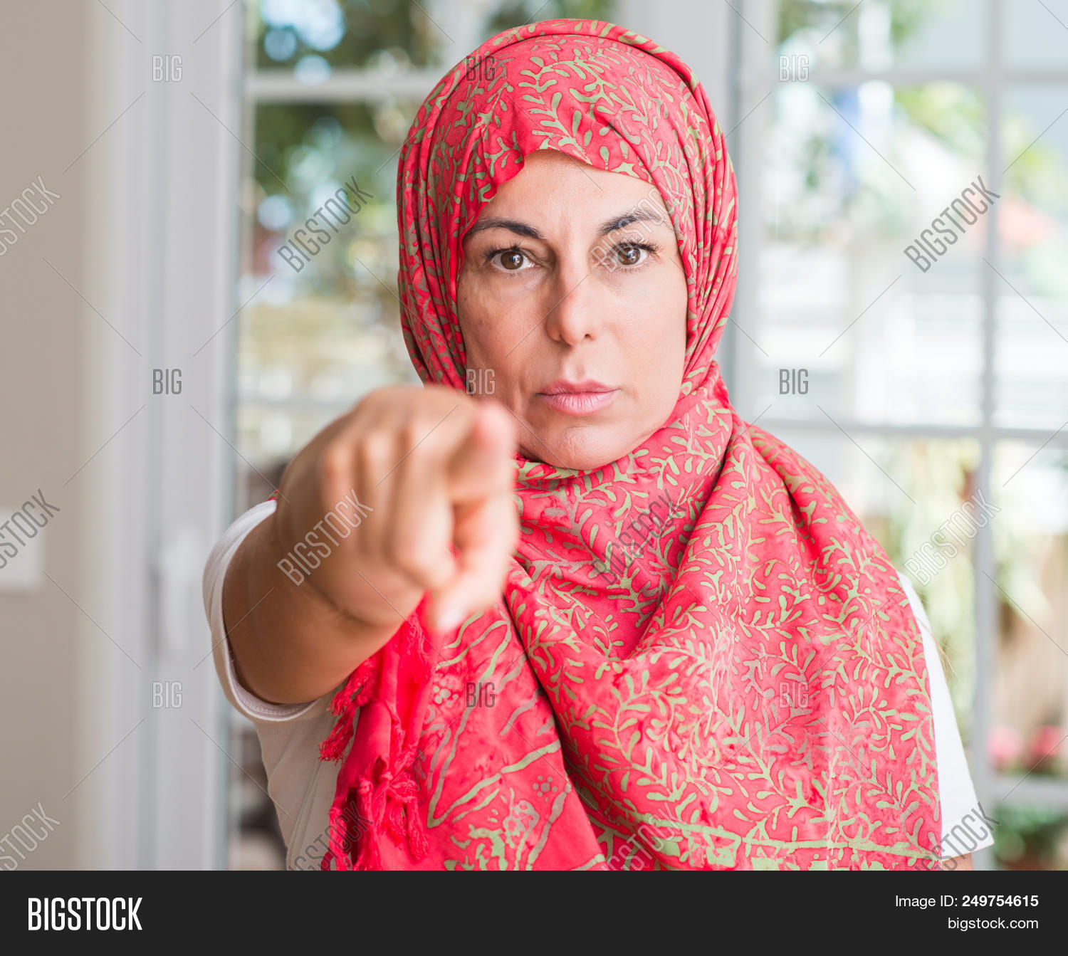 arab,arabian,arabic,beautiful,camera,choice,choose,concept,confident,convinced,eastern,energy,ethnic,expression,face,female,finger,front,frontal,gesture,guiding,hand,hijab,islamic,lady,lider,looking,mad,mature,middle age,muslim,one,point,portrait,positive,proud,religion,scarf,senior,serious,showing,sign,success,sure,traditional,want,white,woman,you
