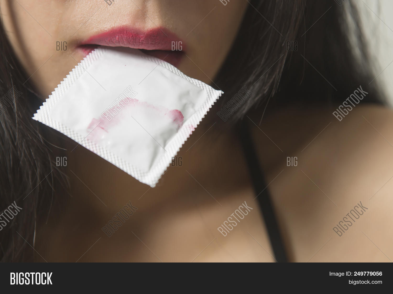 adult,aids,attractive,background,beautiful,beauty,bedroom,bite,black,caucasian,closeup,concept,condom,contraceptive,cute,female,girl,hand,happy,health,healthy,hold,holding,human,isolated,lady,lips,lipstick,mouth,people,person,portrait,pretty,protection,safe,sensual,sex,sexual,sexy,white,woman,young