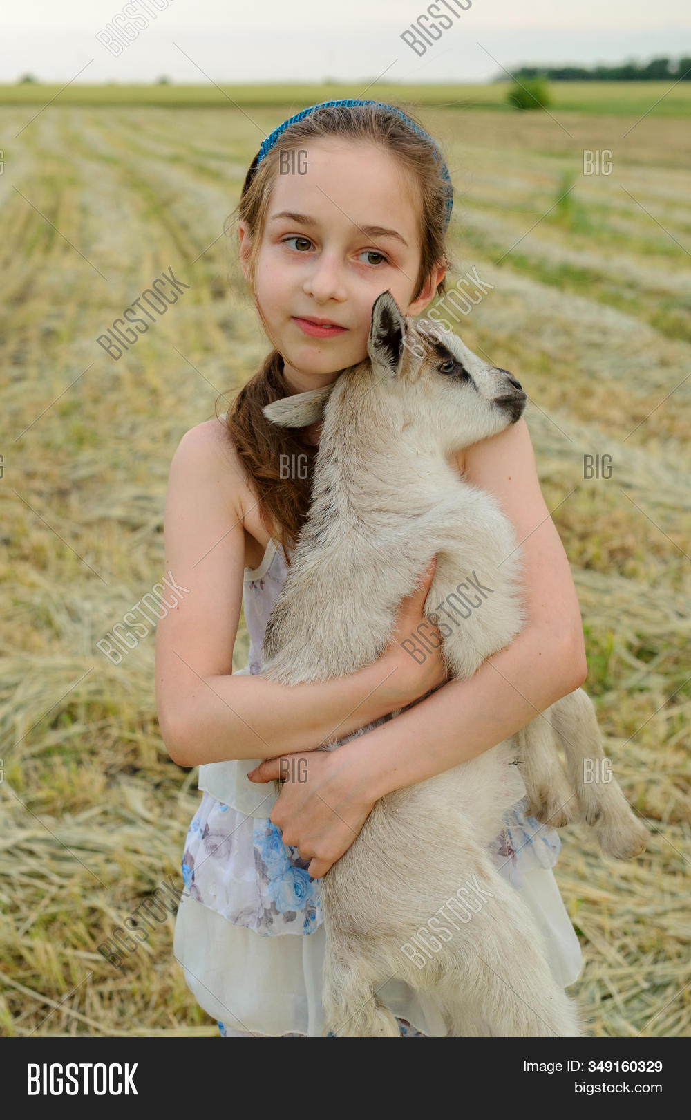 girl,goat,animal,young,child,nature,cute,summer,beautiful,little,outdoor,kid,person,green,childhood,country,farm,caucasian,happy,livestock,feed,white,female,people,grass,pet,pretty,adorable,countryside,happiness,portrait,cattle,pasture,care,beauty,mammal,love,village,fun,hair,youth,agriculture,background,food,spring,baby,woman,brunette,poor