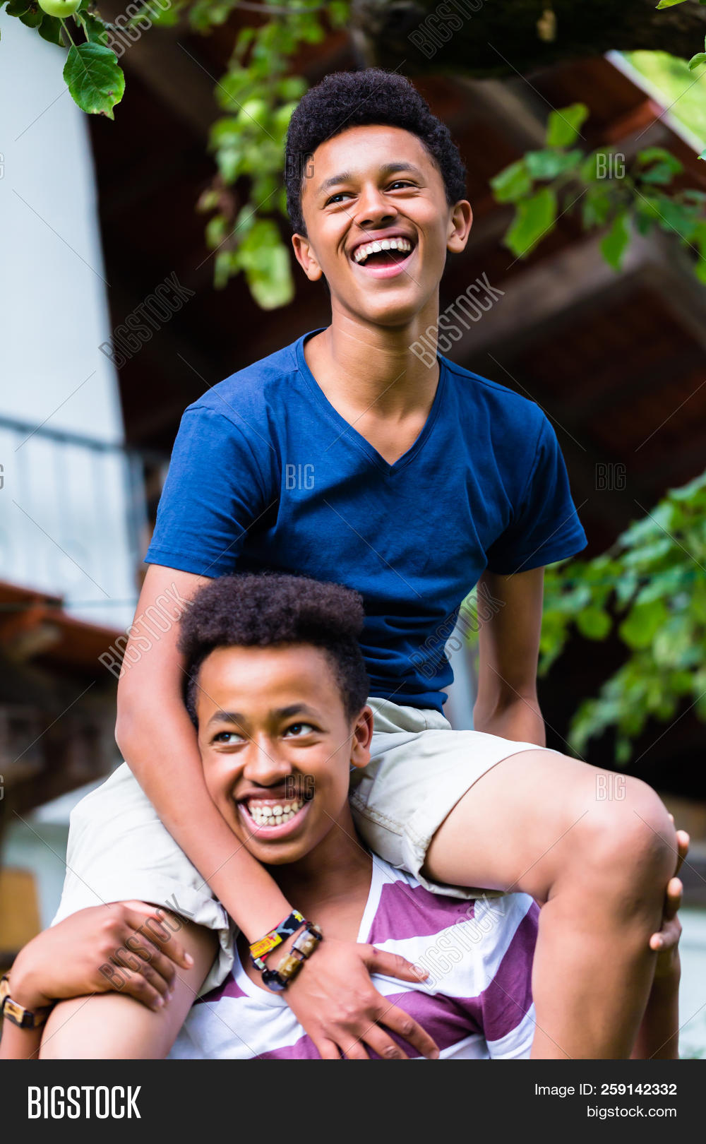 adolescent,african,afro,away,balance,black,bonding,boy,bracelet,carrying,casual,cheerful,child,close-up,day,enjoy,friend,friendship,front,fun,guy,happy,hispanic,hold,human,joy,kid,laugh,lifestyle,look,outdoors,people,play,portrait,ride,selective,shoulder,sit,smile,strength,teenage,teenager,together,togetherness,trust,two