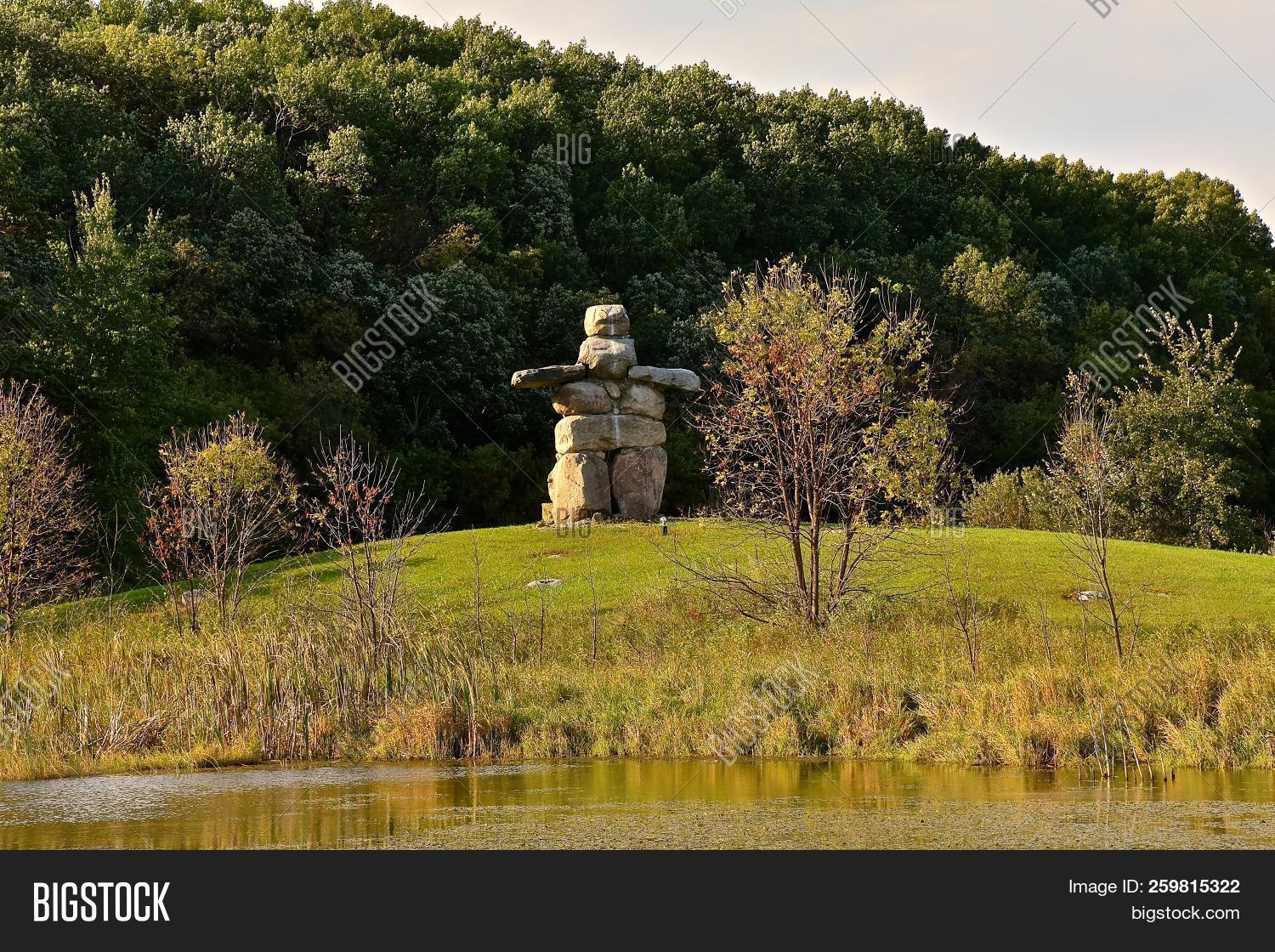 Minnesota,arctic,art,balance,canada,culture,design,direction,directional,group,historic,history,inlet,inuit,inukshuk,inuksuit,inuksuk,isolated,journey,landmark,landscape,marker,misplaced,monument,native,north,northern,nunavut,outdoors,pointer,rocks,sculpture,site,standing,statue,stone,structure,symbol,tradition,traditional,woods