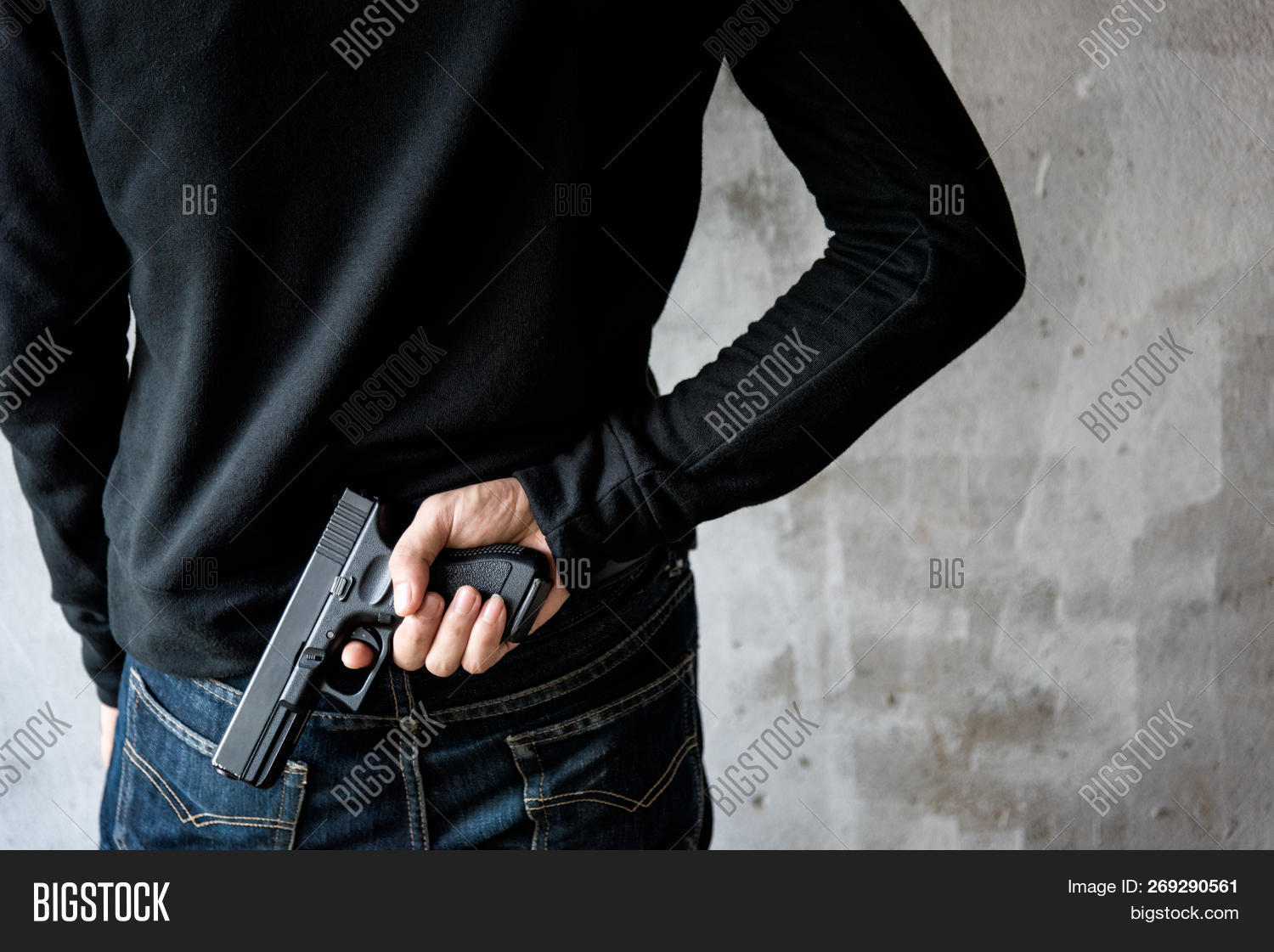 arm,army,asia,asian,attack,bang,black,carry,casual,concealed,concept,crime,criminal,danger,defend,defense,firearm,gangster,gun,gunman,guy,hand,handgun,hidden,holding,holster,hunter,jeans,killer,mafia,male,man,murder,murderer,pistol,revolver,robber,robbery,safety,shooting,shotgun,spy,terrorism,terrorist,violence,war,weapon,young
