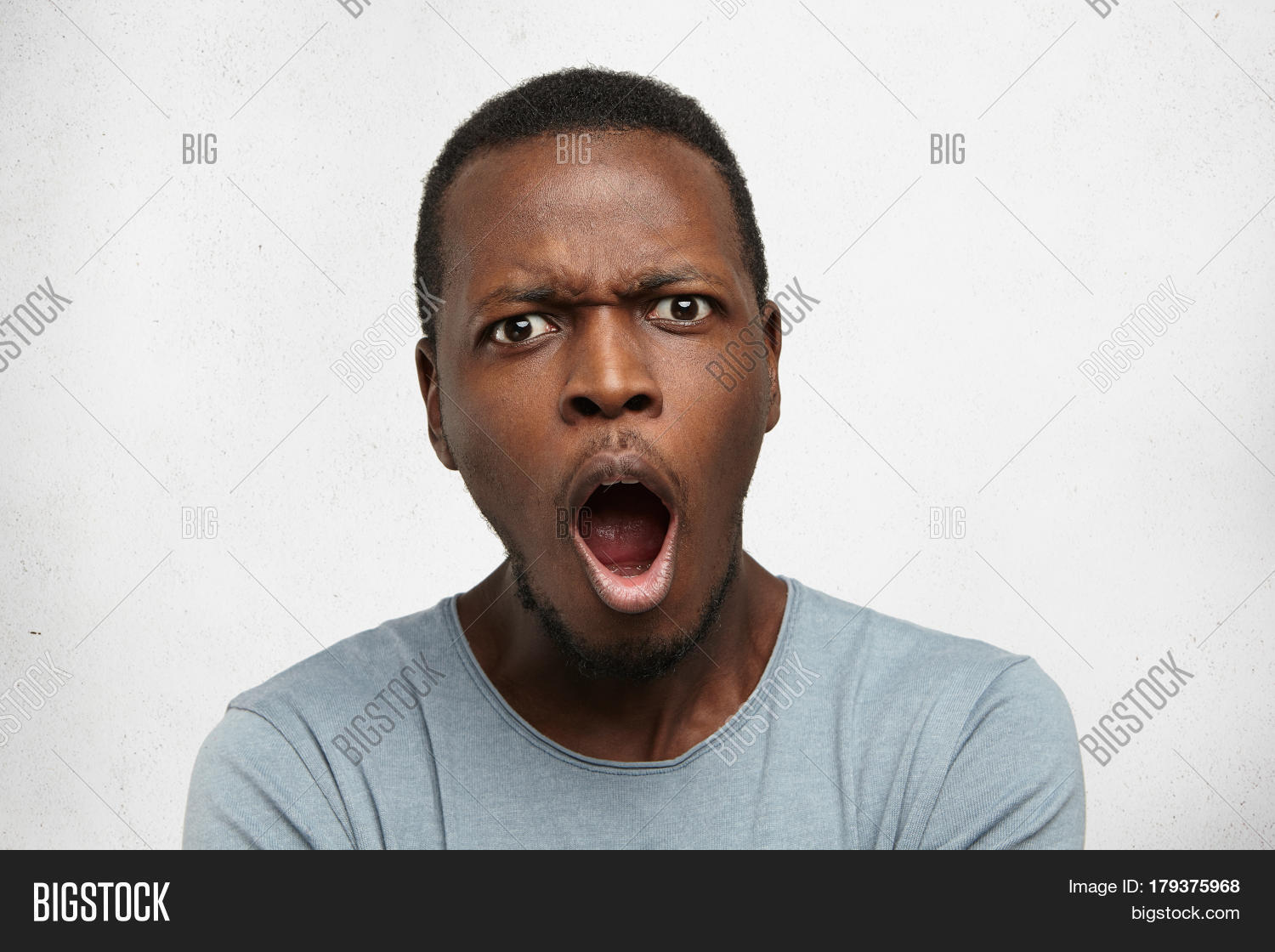 adult,african,amazed,amazement,amazing,american,astonished,attractive,background,black,boy,business,concept,daze,exclaim,expression,face,fear,good,guy,handsome,isolated,joy,look,male,men,model,mouth,news,omg,one,open,people,person,portrait,positive,reaction,shirt,shock,smart,student,studio,surprise,unexpected,wall,white,wonder,worker,wow,young