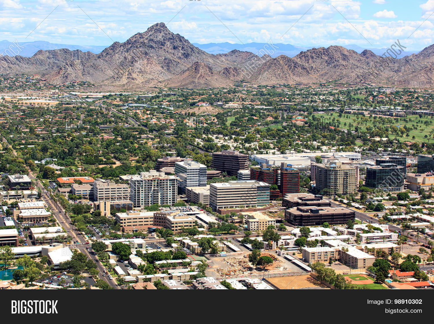 aerial,apartments,architecture,arizona,arizona desert,buildings,camelback,commercial,course,desert,elevated,finance,golf,hotel,mixed,mountains,office,outdoors,palm,peak,phoenix,phoenix arizona,piestewa,recreation,residential,resort,retail,road,shopping,skylne,streets,travel,trees,use,vehicles