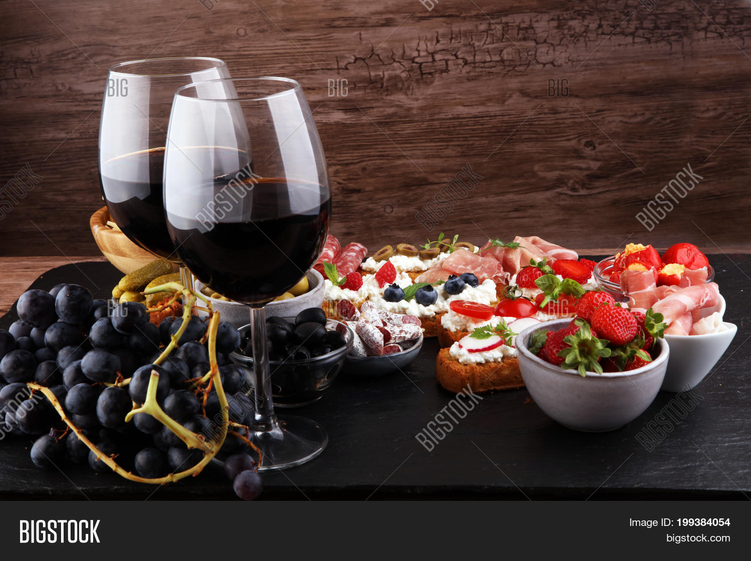 alcohol,antipasti,antipasto,appetizer,bar,board,bread,buffet,cheese,cuisine,dark,delicatessen,delicious,dinner,drink,eating,food,fresh,fruit,garlic,glass,gourmet,ham,italian,meal,meat,olive,pickles,prosciutto,restaurant,rustic,set,snack,spanish,tapas,tasty,tomato,traditional,variety,wine,wooden